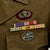 Original U.S. WWII Combat Medic 11th Airborne Ike Jacket with Australian Made Jump Wings Original Items