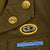 Original U.S. WWII 187th Glider Infantry Regiment (GIR) Named Ike Jacket and Hand Painted B-4 Bag Original Items