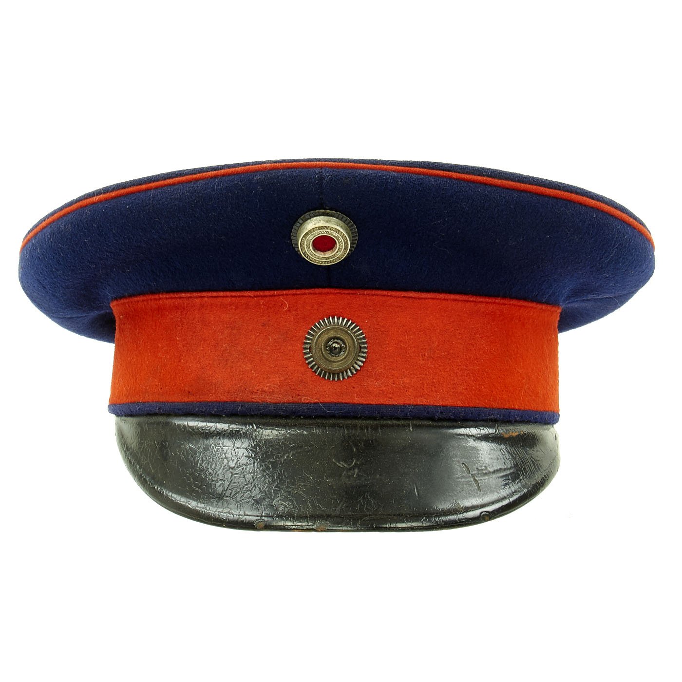 An Imperial German officer visor cap for Prussian Regiments, Dark blue cap  body, red band, red piping, black visor, officer Prussian and national  cockades, brown leather sweatband with fine white silk lining.